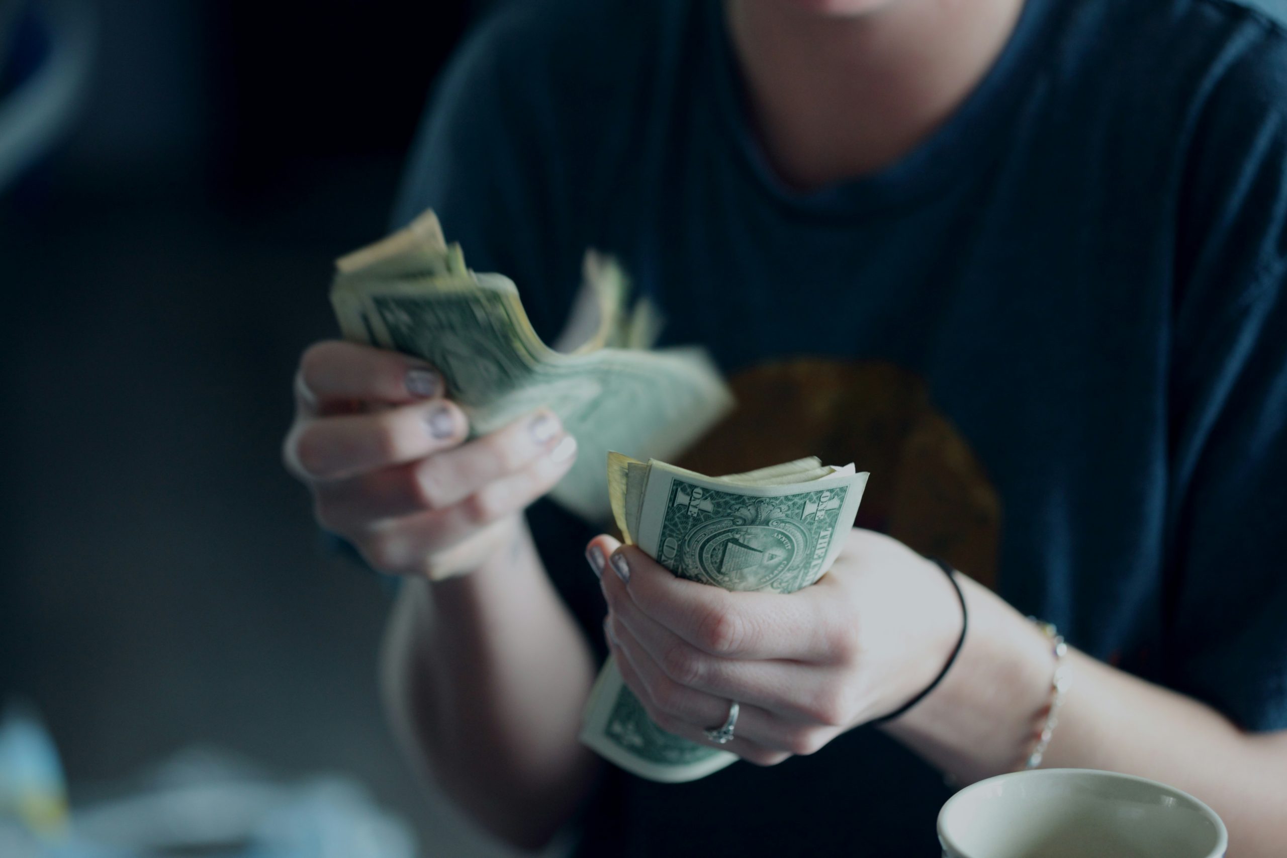 an individual counting their money