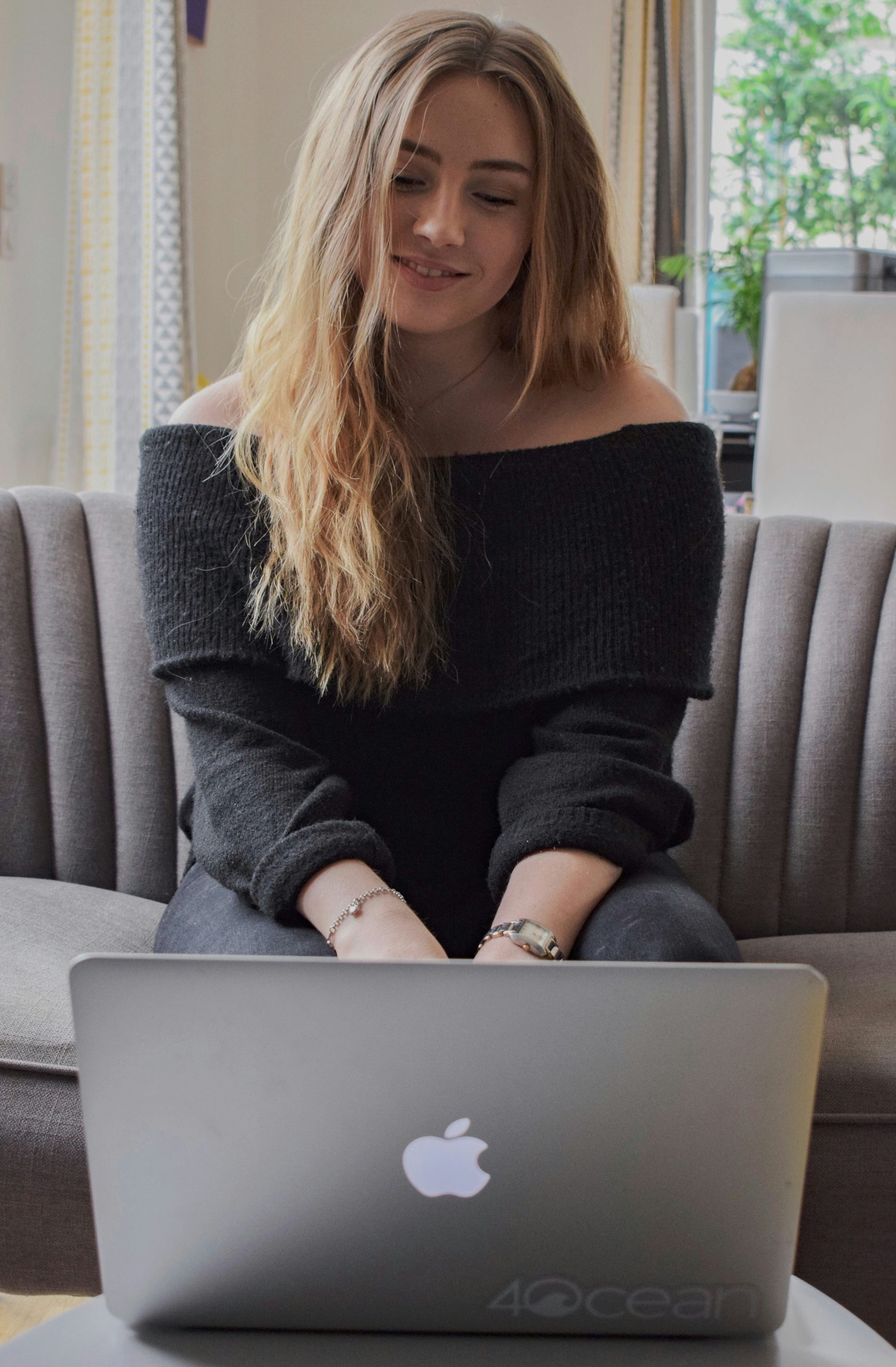 a woman using her laptop to look at finance options