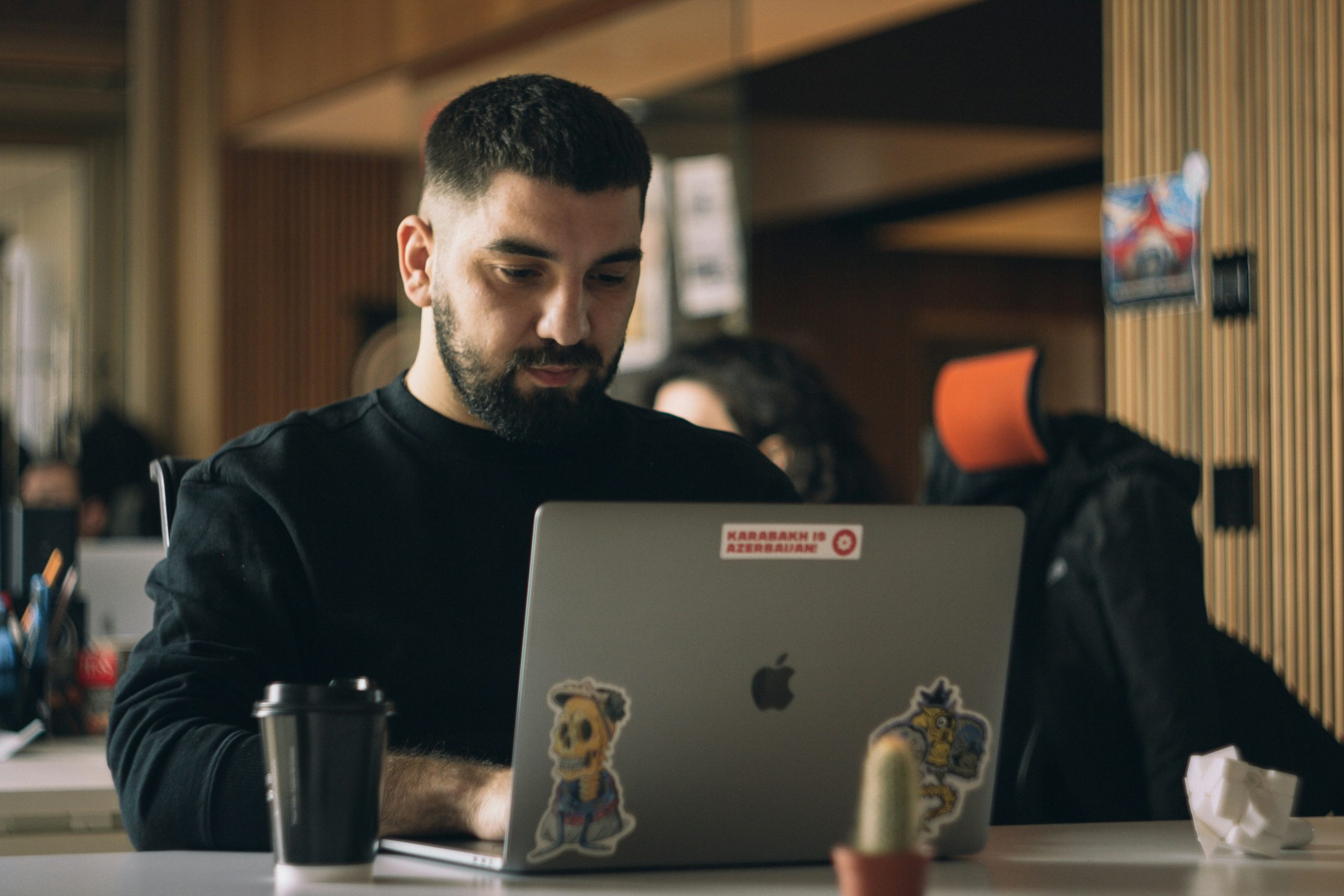 a man on their laptop reviewing their work