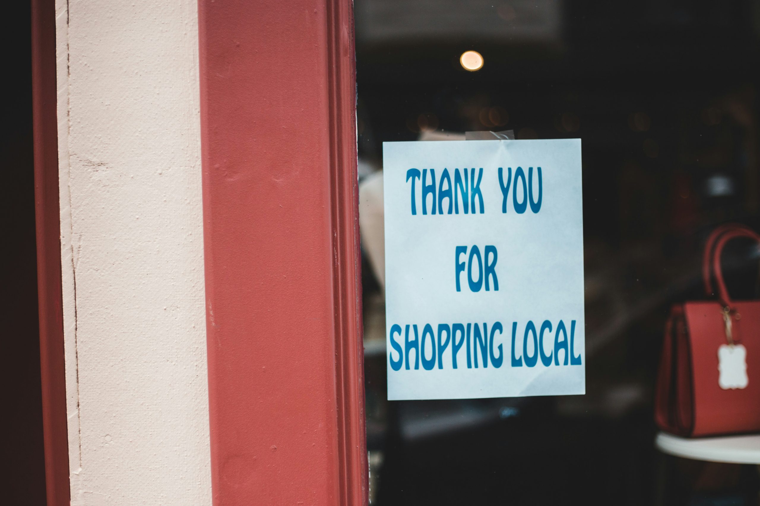 a thank you for shopping local sign