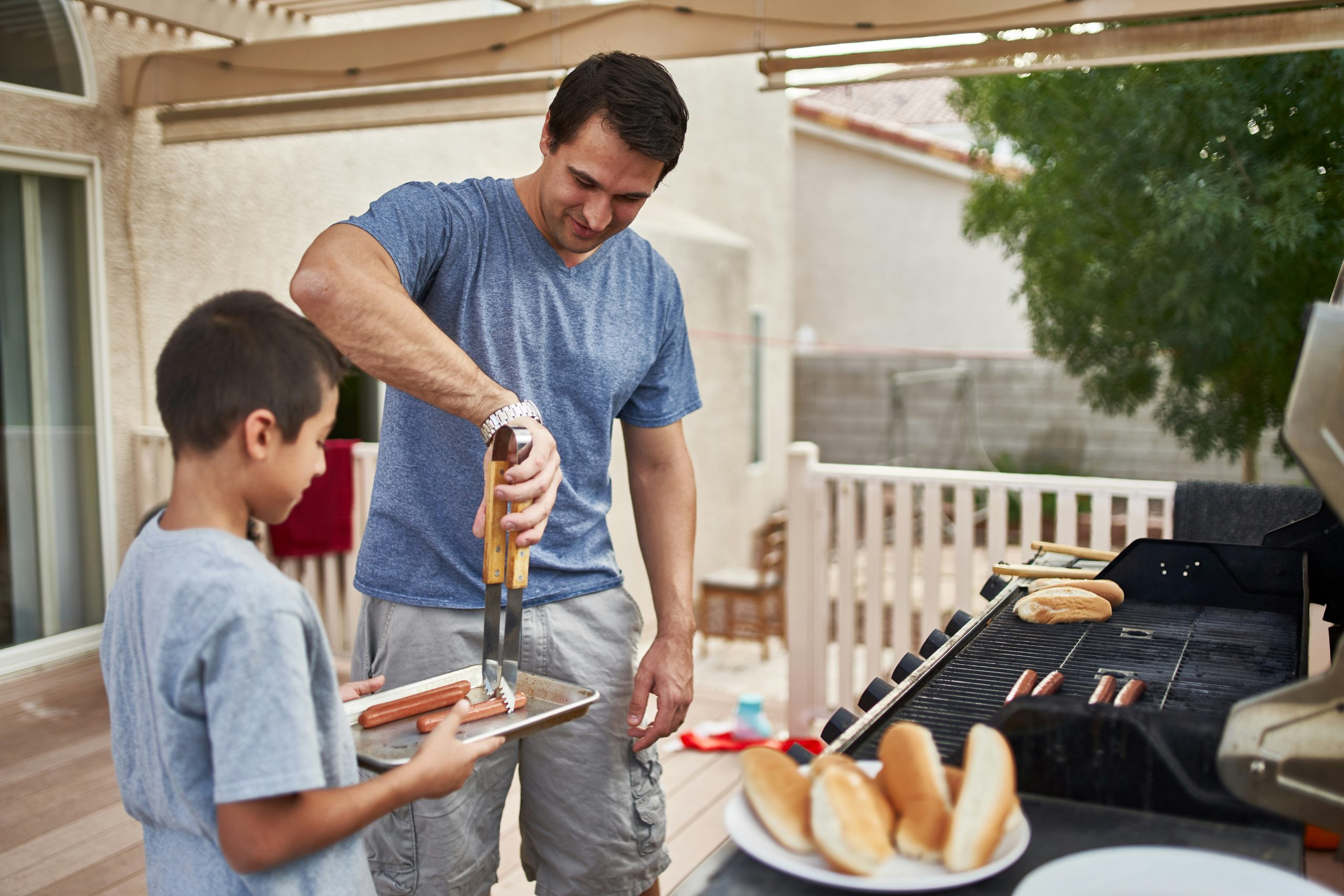 a father and son having a bbq