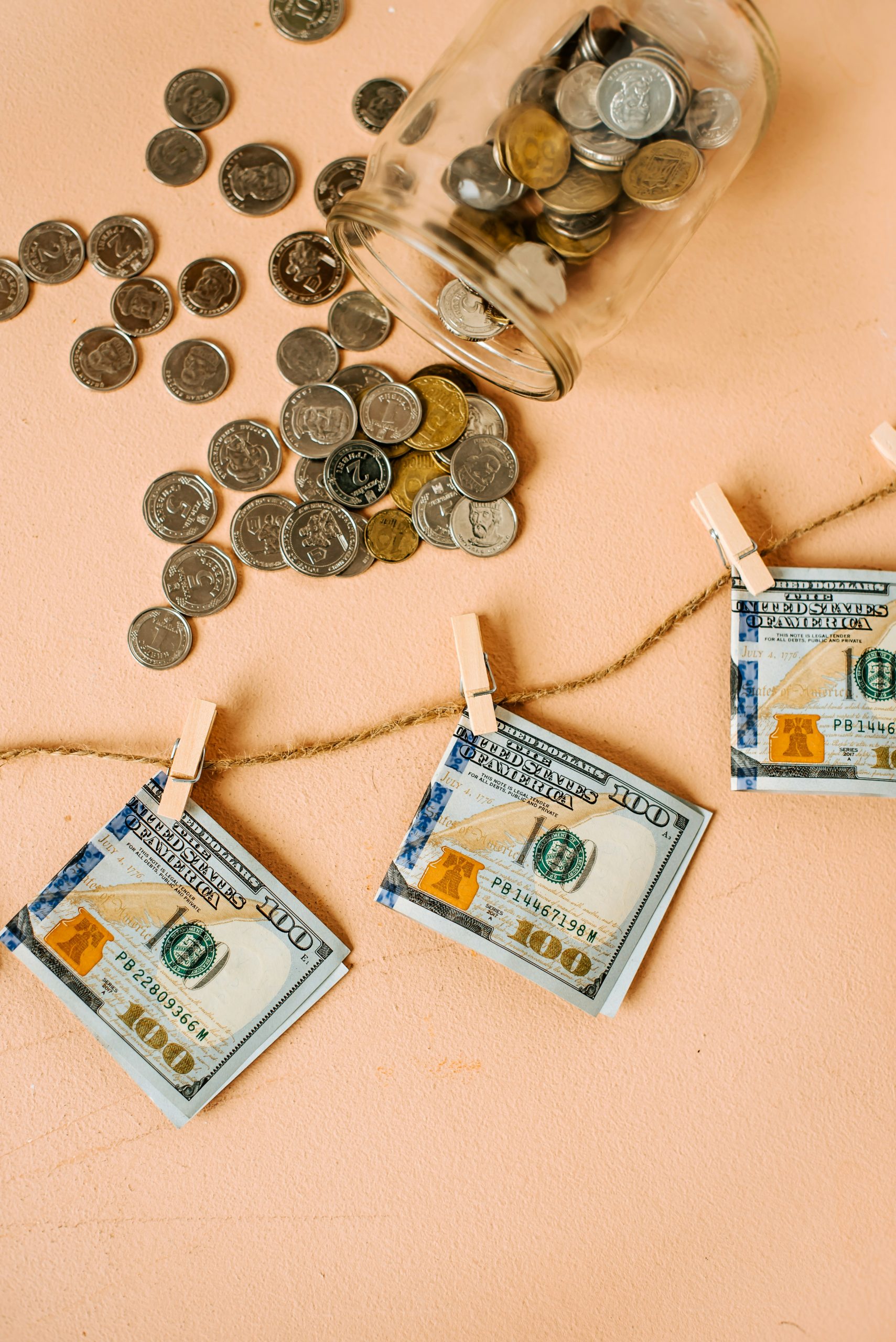 some dollars and change on a washing line